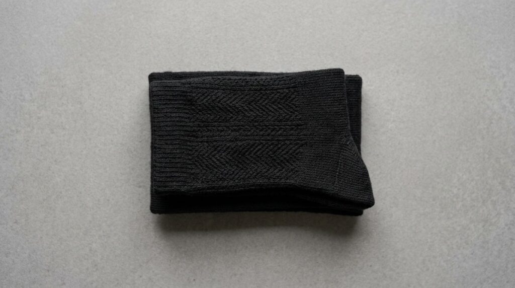 Close-up product photography of premium black thermal socks
